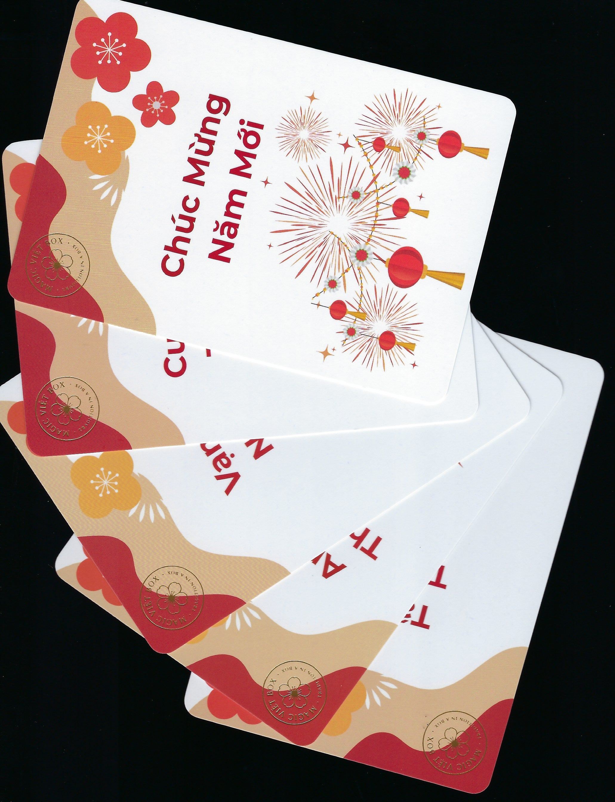 Set of cards with festive designs and text on a black background